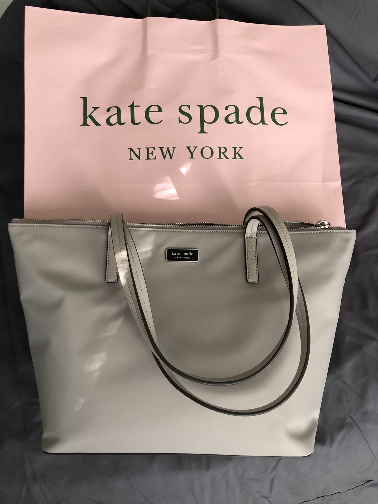 Brand new Kate Spade purse. Never used and has tags on it. Also have the receipt.