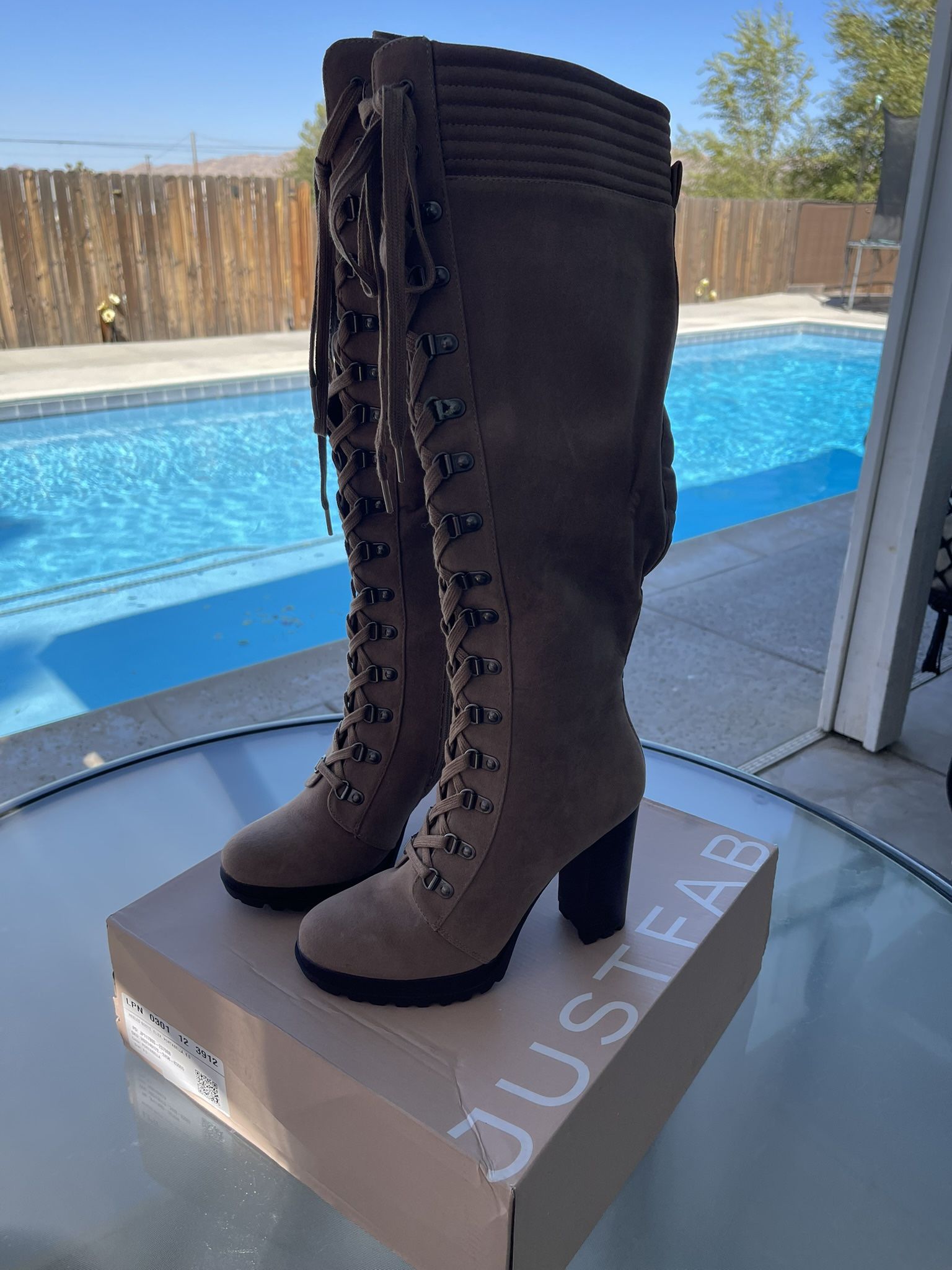 Woman’s Tan Knee High Heeled Boots