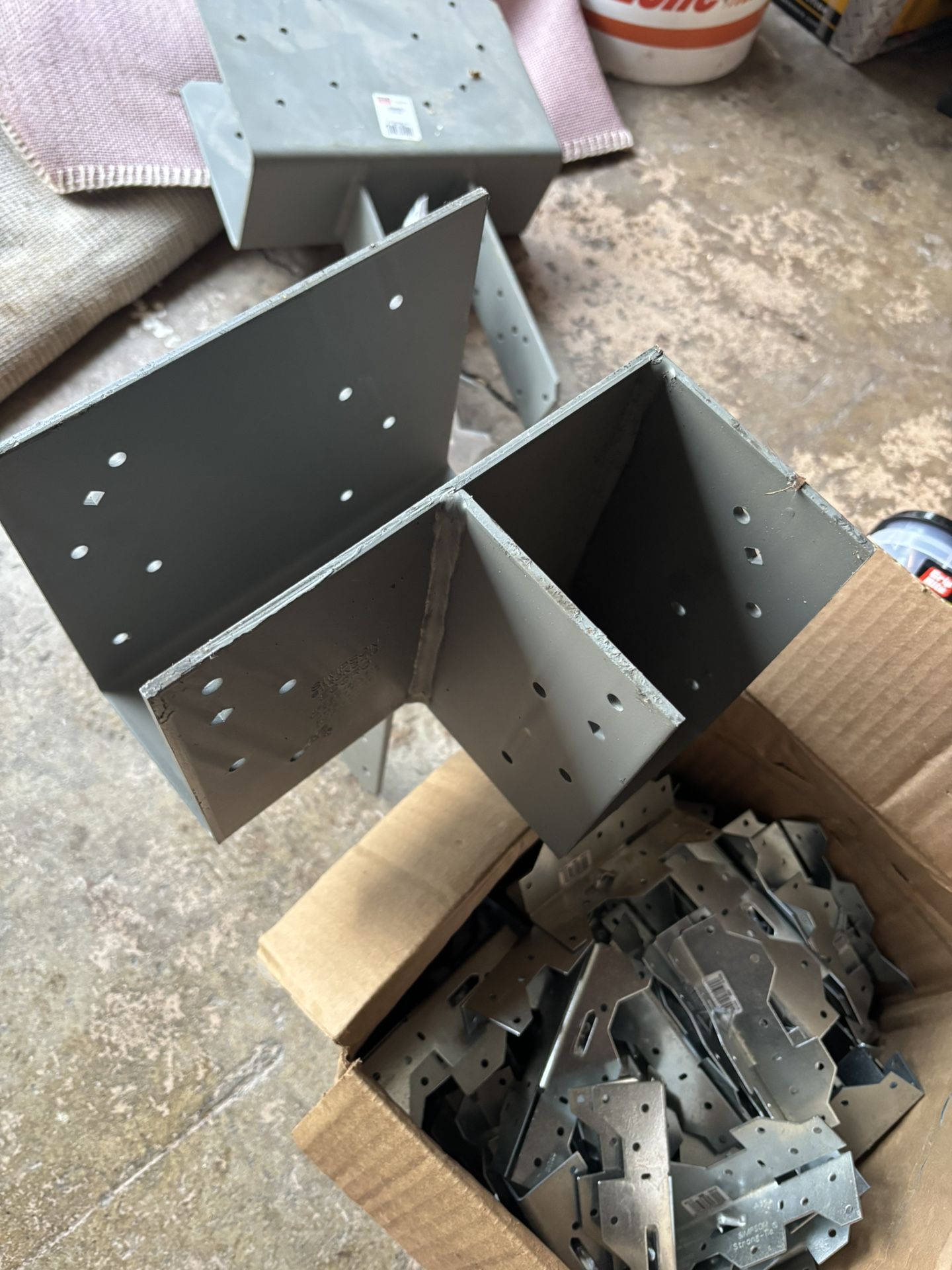 Leftover construction material the bucket there are 4 x 4 seven bucks on nails screw 3 inches hangers and full box 08 35