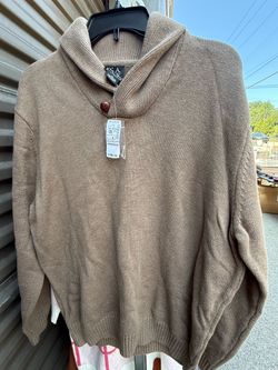 tan Jos. A. Bank shawl collar sweater features a prominent button closure at the neck