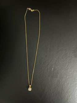 Cadena de oro 14k con dije de 4 diamantes.