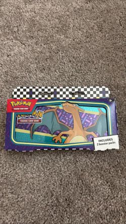 Charizard pencil box with tcg packs inside