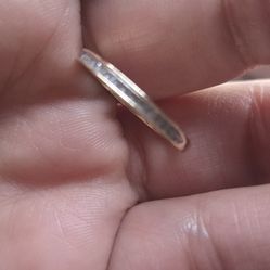 A 10 k yellow solid gold with 22 1/4 k natural digged in stones..gives it a beautiful shine..