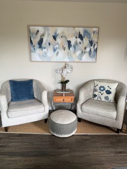 2 off-white barrel chairs