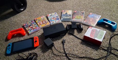 Nintendo switch with 4 controllers and  other paddles 6 games ,