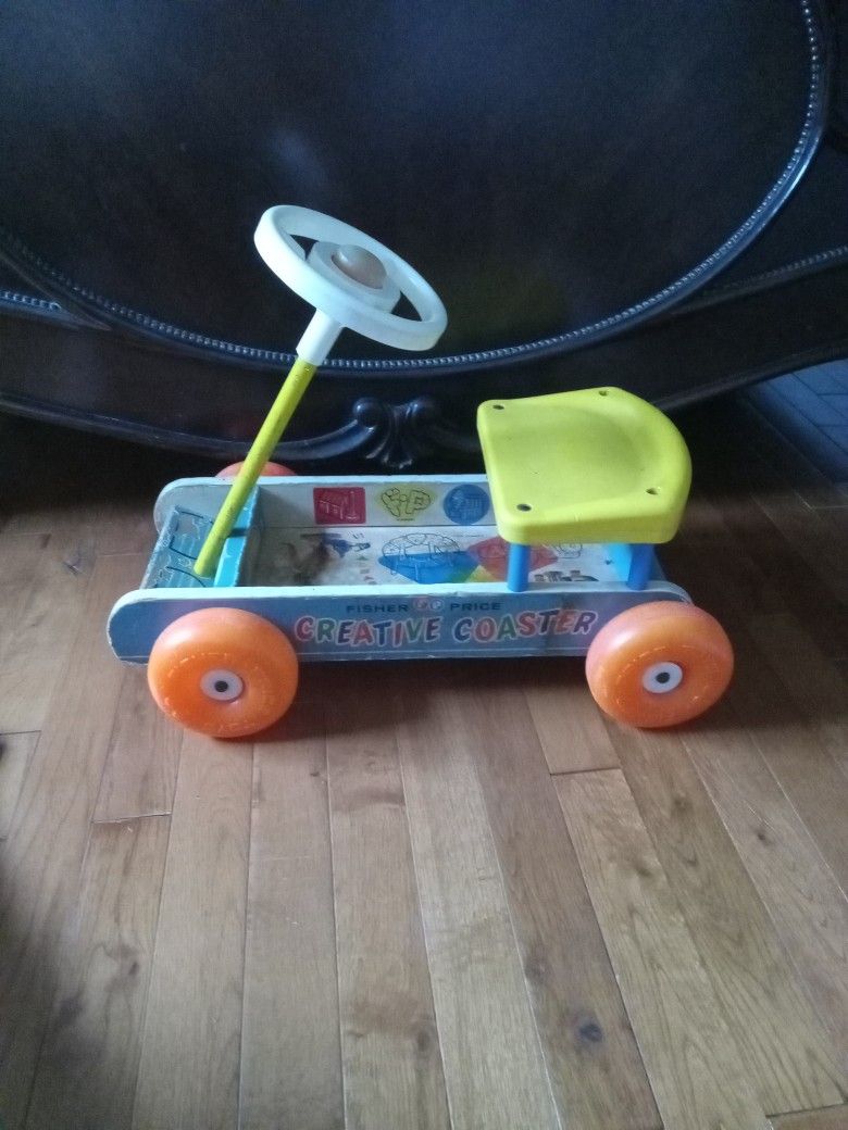 Fisher Price Antique Scooter Toy.
