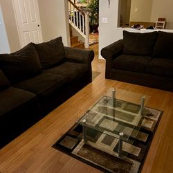 Couch and love seat with coffee table