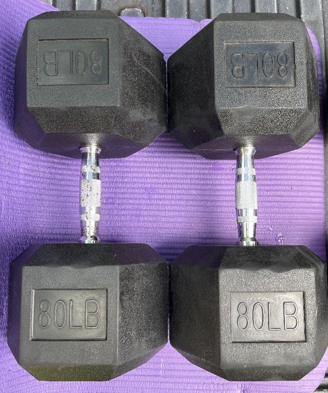 USED 80 LB. RUBBER DUMBBELLS