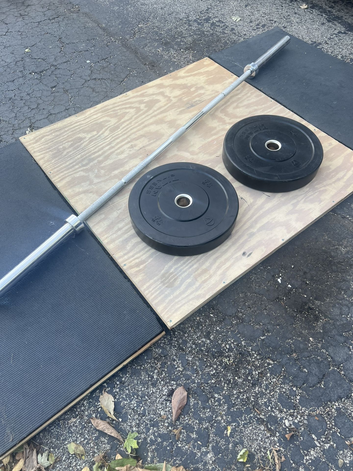 Titan Bumper Plates With Olympic Barbell And Deadlifting Platform