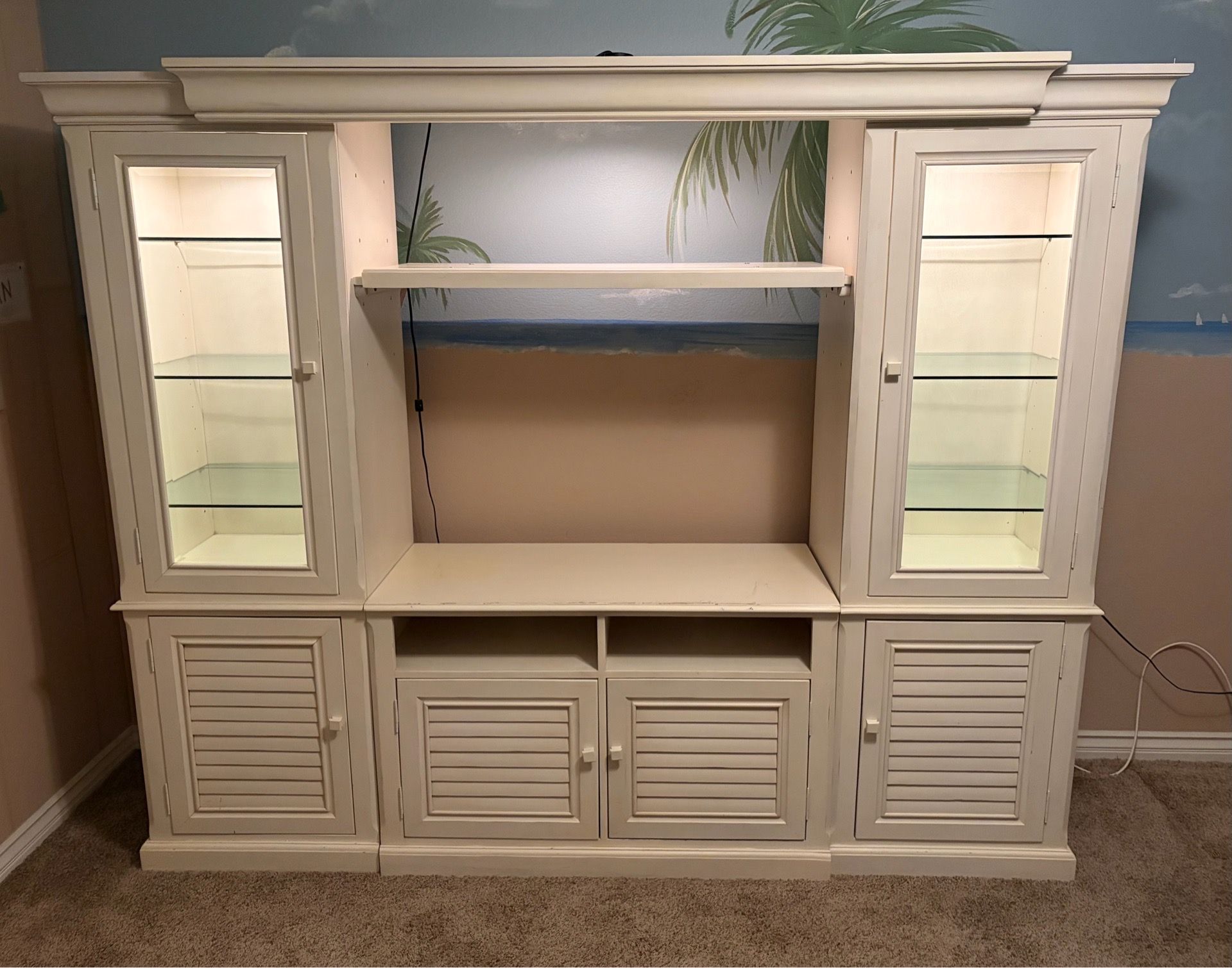 White wood entertainment center with lighting