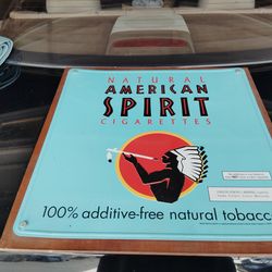 Vintage embossed metal sign