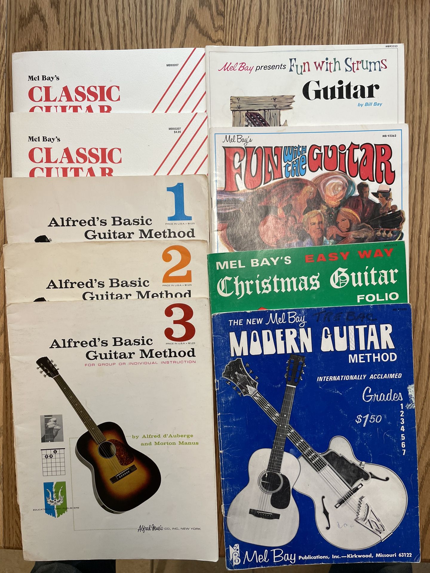 Nine Mel Bay and Alfreds guitar workbooks
