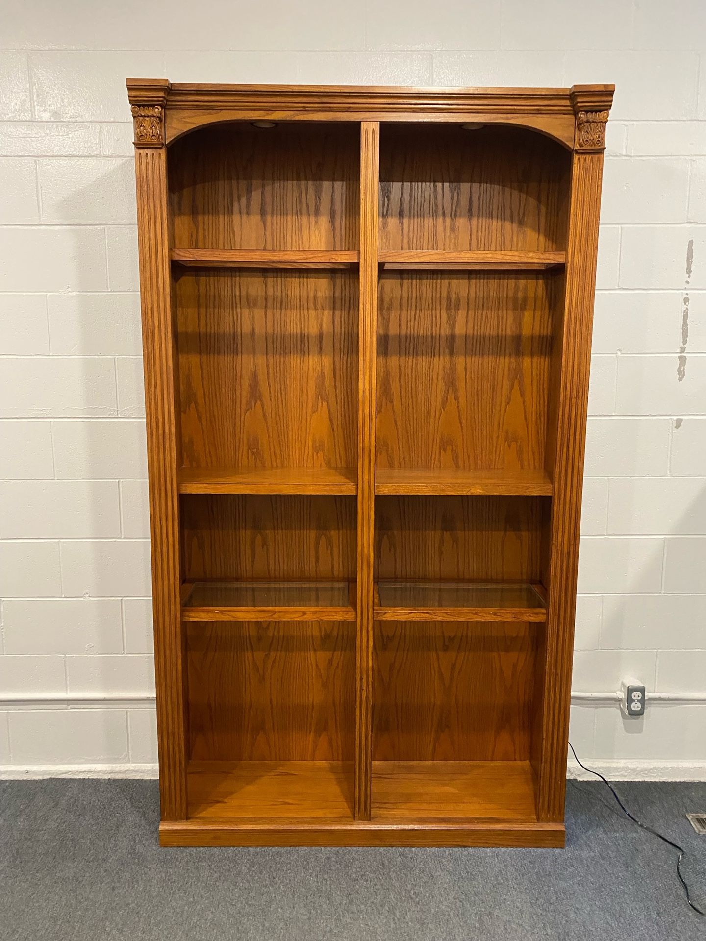 Oak Book Shelf. Has Glass Shelves. More Shelves Come With It. Very Elogant