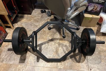 Dual grip hex bar with two 55 lbs rubber plates
