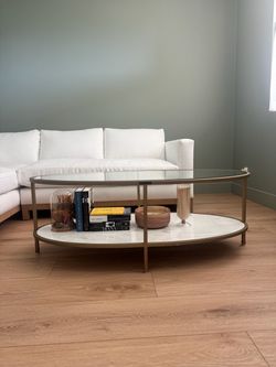 Magnolia Home by Joanna Gaines Oval Glass Coffee Table – $350