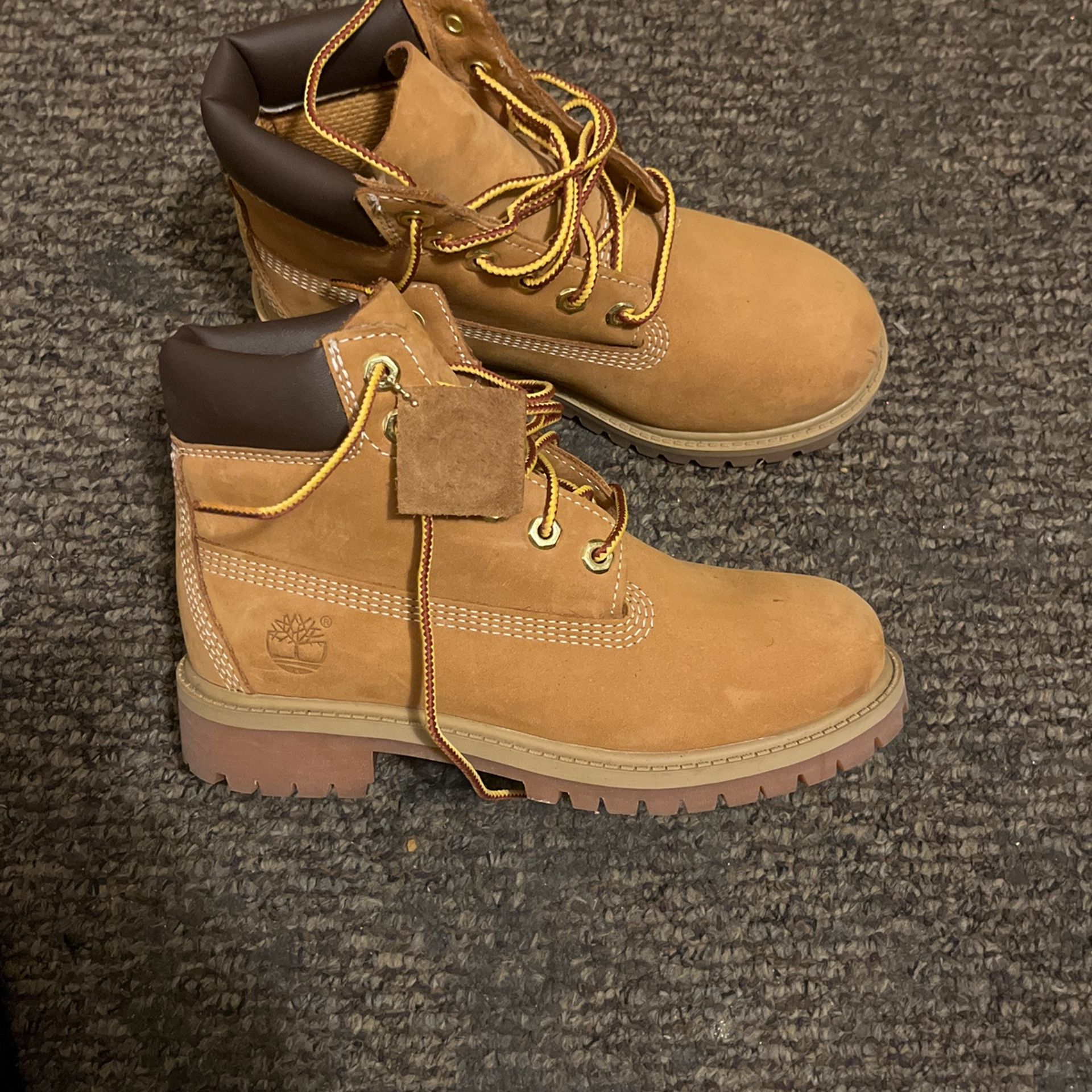 Size one wheat timberland boots for kids