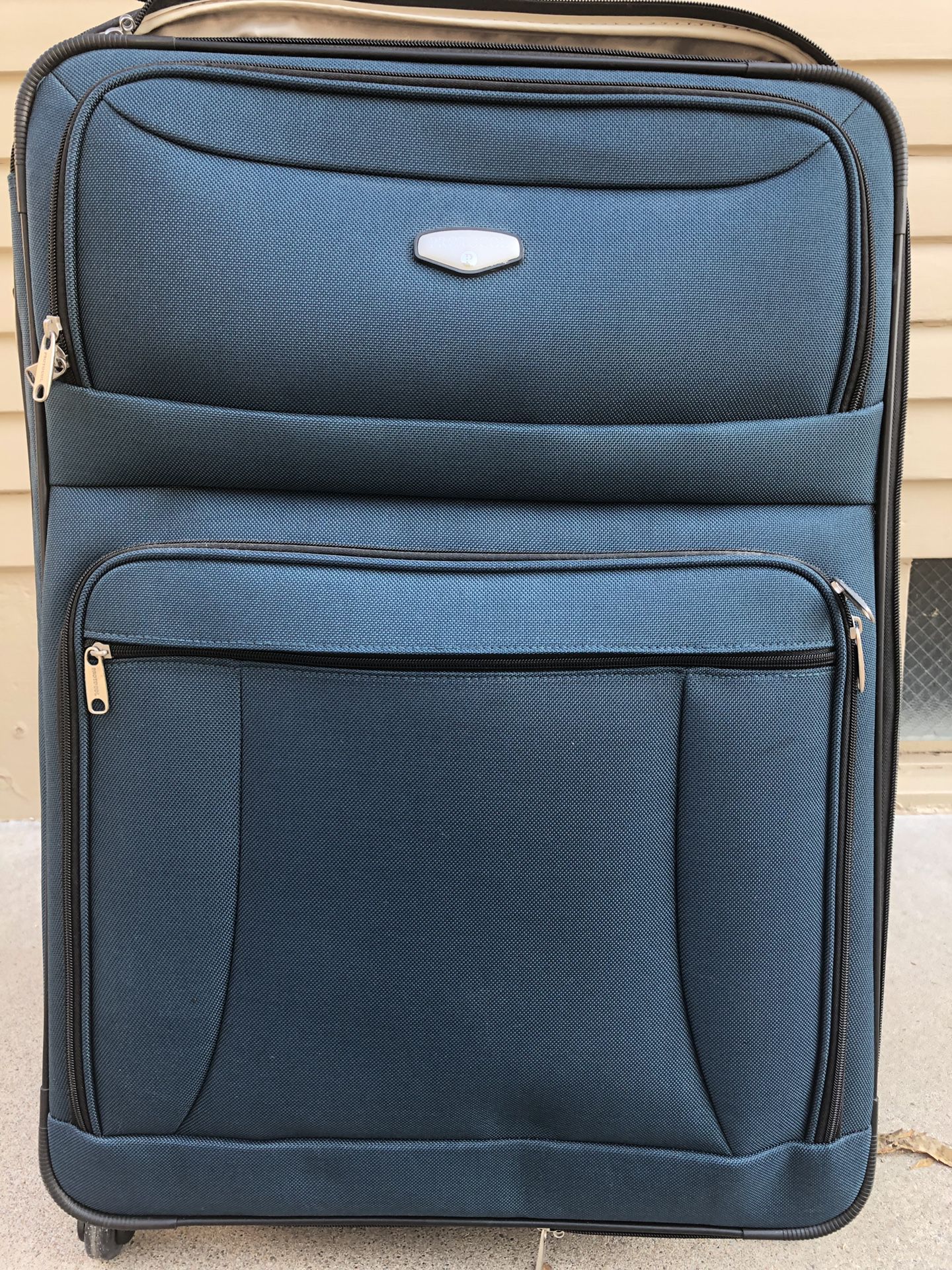 Teal three-piece Protocol luggage.