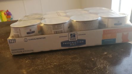 24 cans Hills prescription diet cat food.
