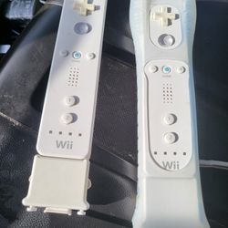 2 Nintendo Wii remotes with Motion plus adapters included. 
Great condition 
Working perfectly