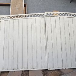   Wooden and iron patio door, 64 inches wide x 72 1/2 inches high (from the wall). 