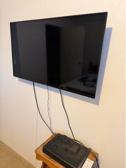 Two tvs and wall mount and speaker