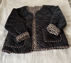 Elegant Black Quilted Jacket with Geometric Trim
