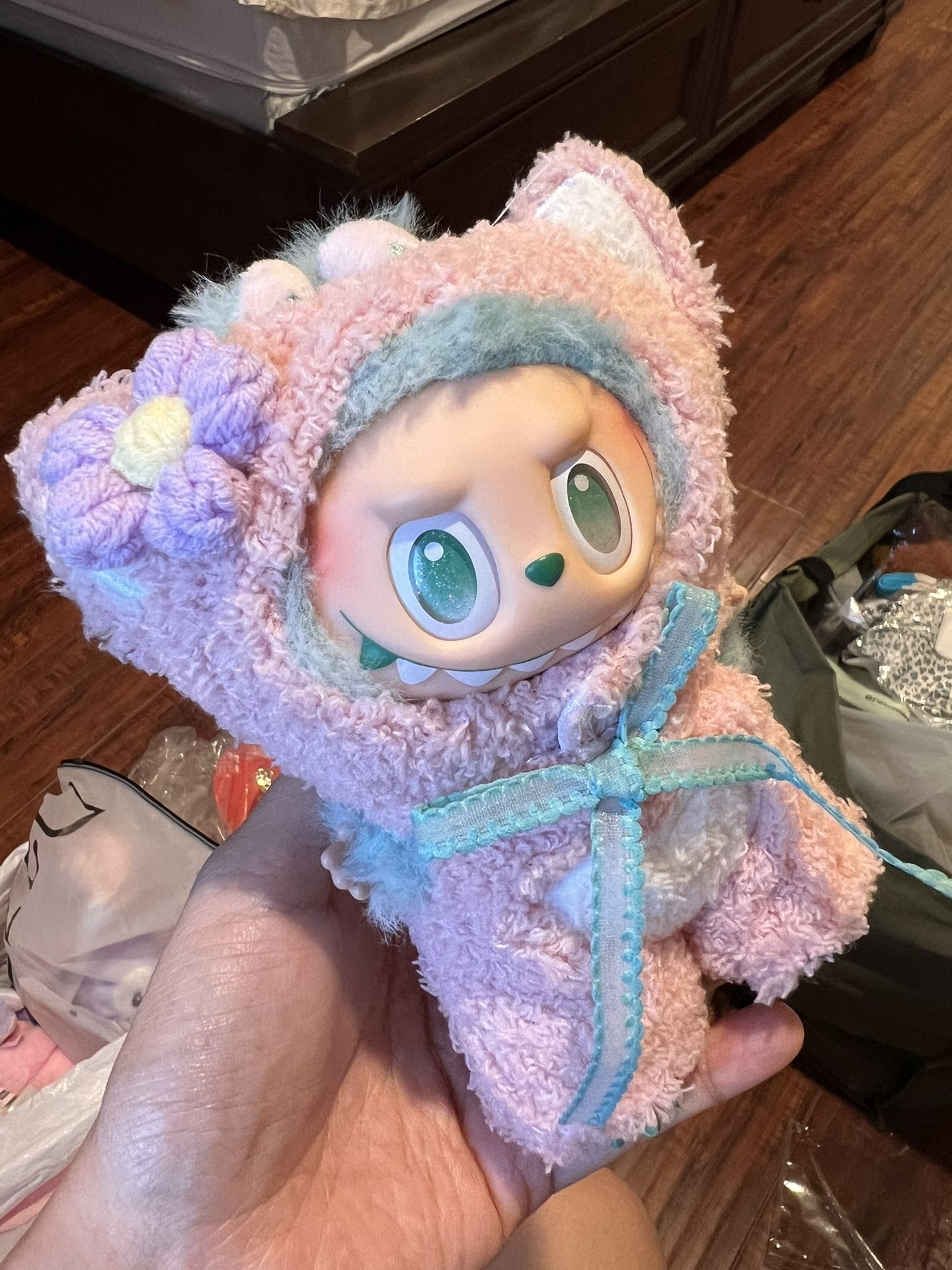 Collectible Plush Doll with Pink Fuzzy Outfit and Flower Hood