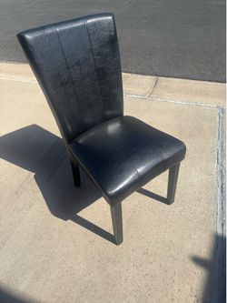 4 black leather chairs