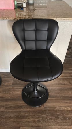 Two black island chairs