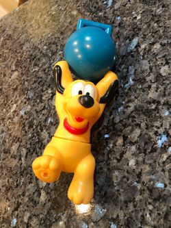 Vintage Rare Disney Pluto Rubber Toy Figure hanging onto a Blue ball.  Size Donald Duck is 6 inches long with the ball included 8 1/2inches long.  Pre
