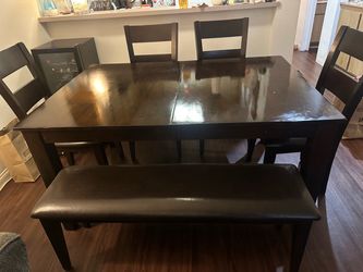 Six piece extendable dining set: table, four upholstered chairs, bench