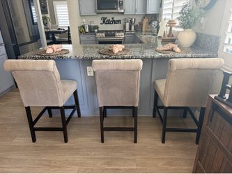 beige counter chairs