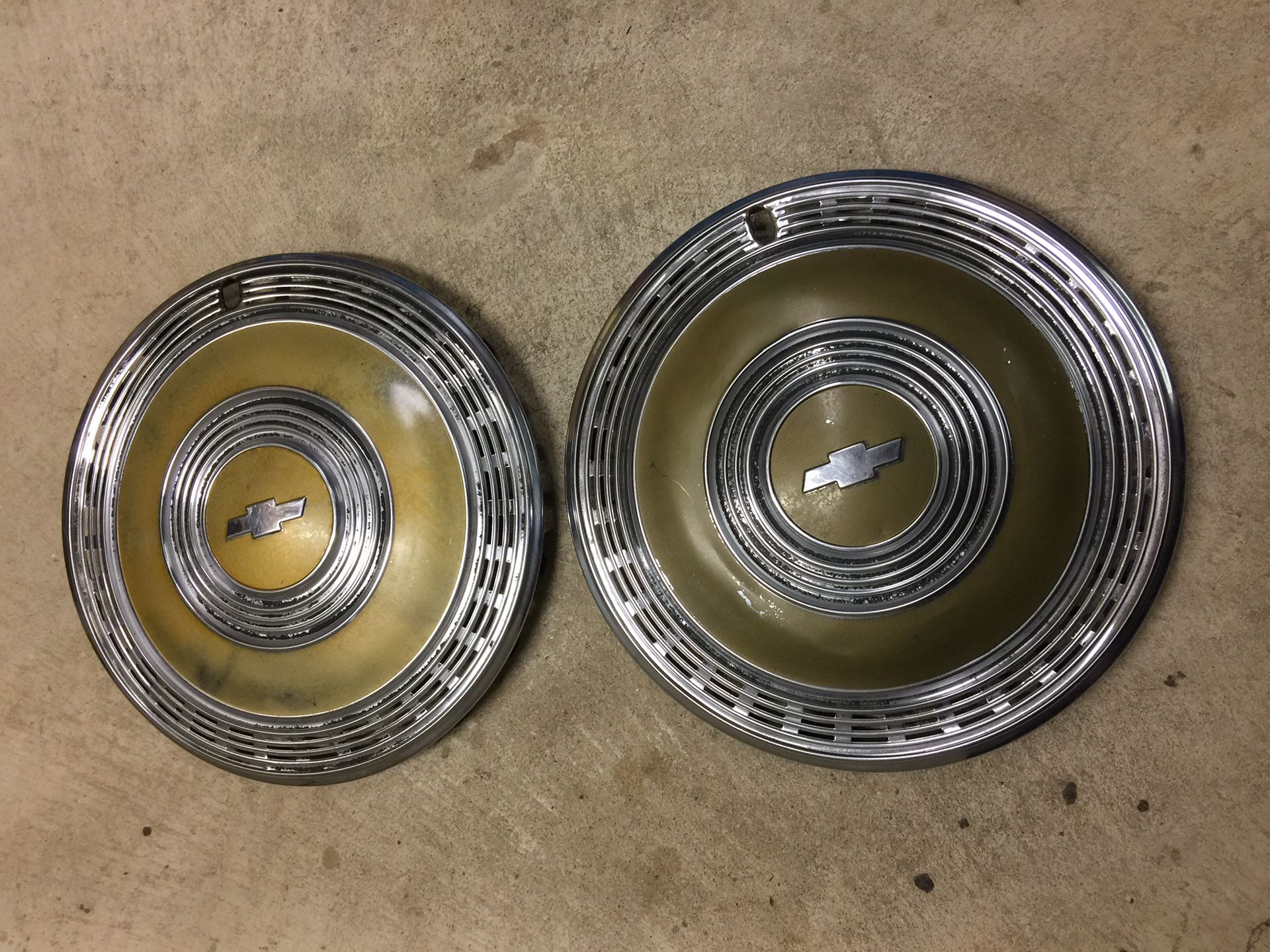 A pair of 1970 Chevy Monte Carlo 15” gold wheel covers. Driver quality.