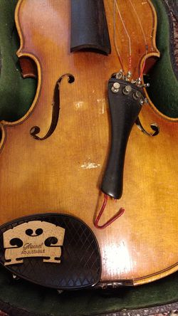My violin full size with two bows one need hair.$ 125.00