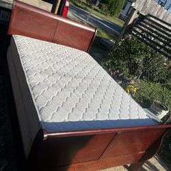 Queen size bed with frame, boxspring, and mattress