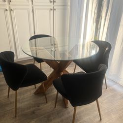 Round glass dining table with chairs