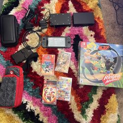 Nintendo Switch OG 400GB - 2 Docks, Ring Fit Adventure, 4 games, HDMI Cable, 2 Wall Chargers, Cases