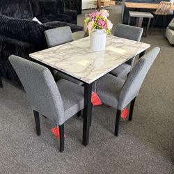 Dining table with 4 chairs in gray Boucle fabric
