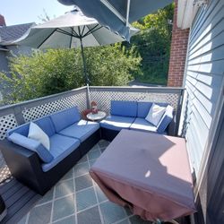 Patio set with Storage box With all the cushions  And a fire table, if you are interested