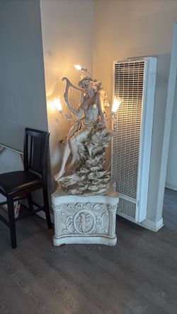 5 foot statue with lights and waterfall
