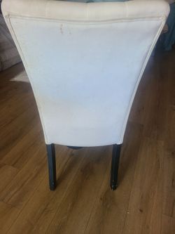 2 white dining chairs