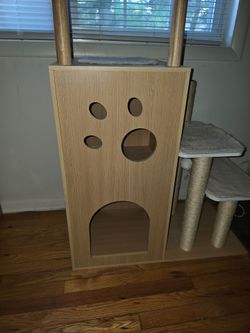 Wooden Cat Tree with Condo and Scratching PostsModern cat tree is constructed from light-toned wood and features a multi-level design. It has a large 