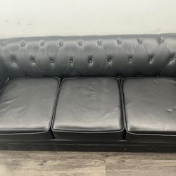 Black tufted couch