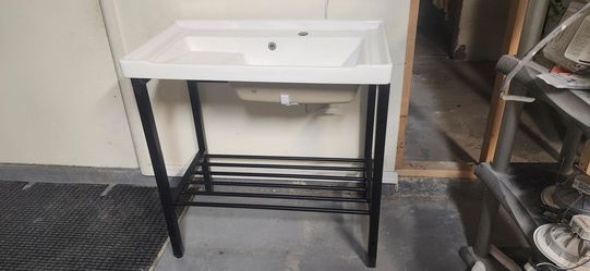 freestanding utility/laundry sinks with metal frames and washboard design: