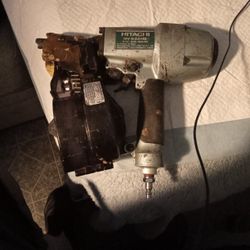 Hitachi NV65AH2 2-1/2" coil siding nailer. 
It is a pneumatic tool that operates at an air pressure of 70-120 psi. 
It drives both wire and plastic sh