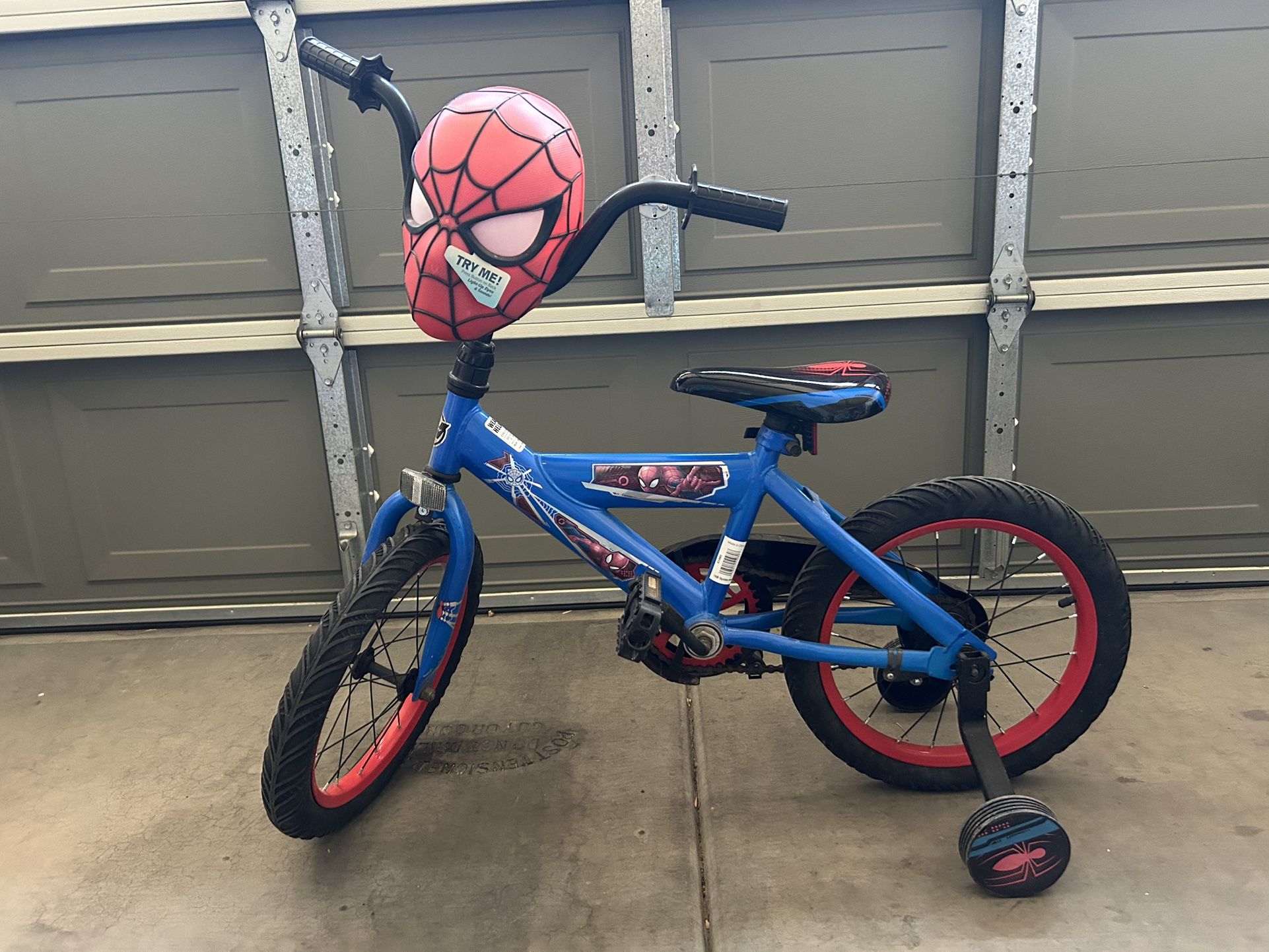 Huffy 16" Marvel Spider-Man Kids' Bike with training wheels and a Spider-Man Helmet