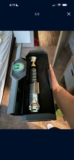 Luke Skywalker Disney lightsaber with saber and box included