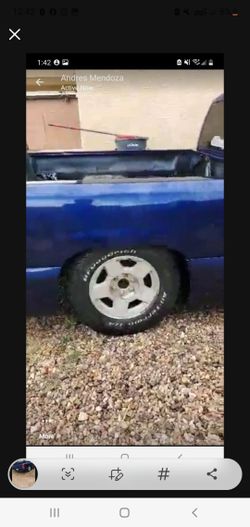 2 Stock Silverado Rims With Caps 
