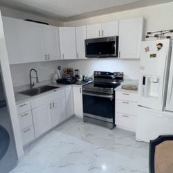 Shaker White Kitchen Cabinets With 60” Island With Gold Sink And Facut And Handle 