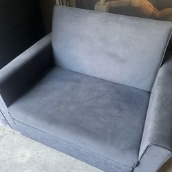 Love seat that folds out to a twin bed